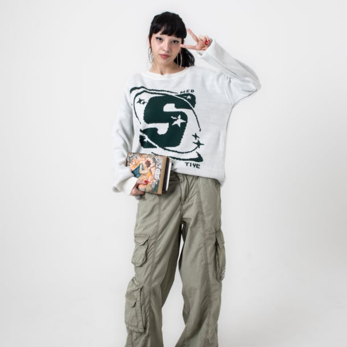 Street-Style Beige Sweater with Green "S" Logo